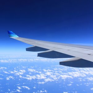 Plane wing above clouds