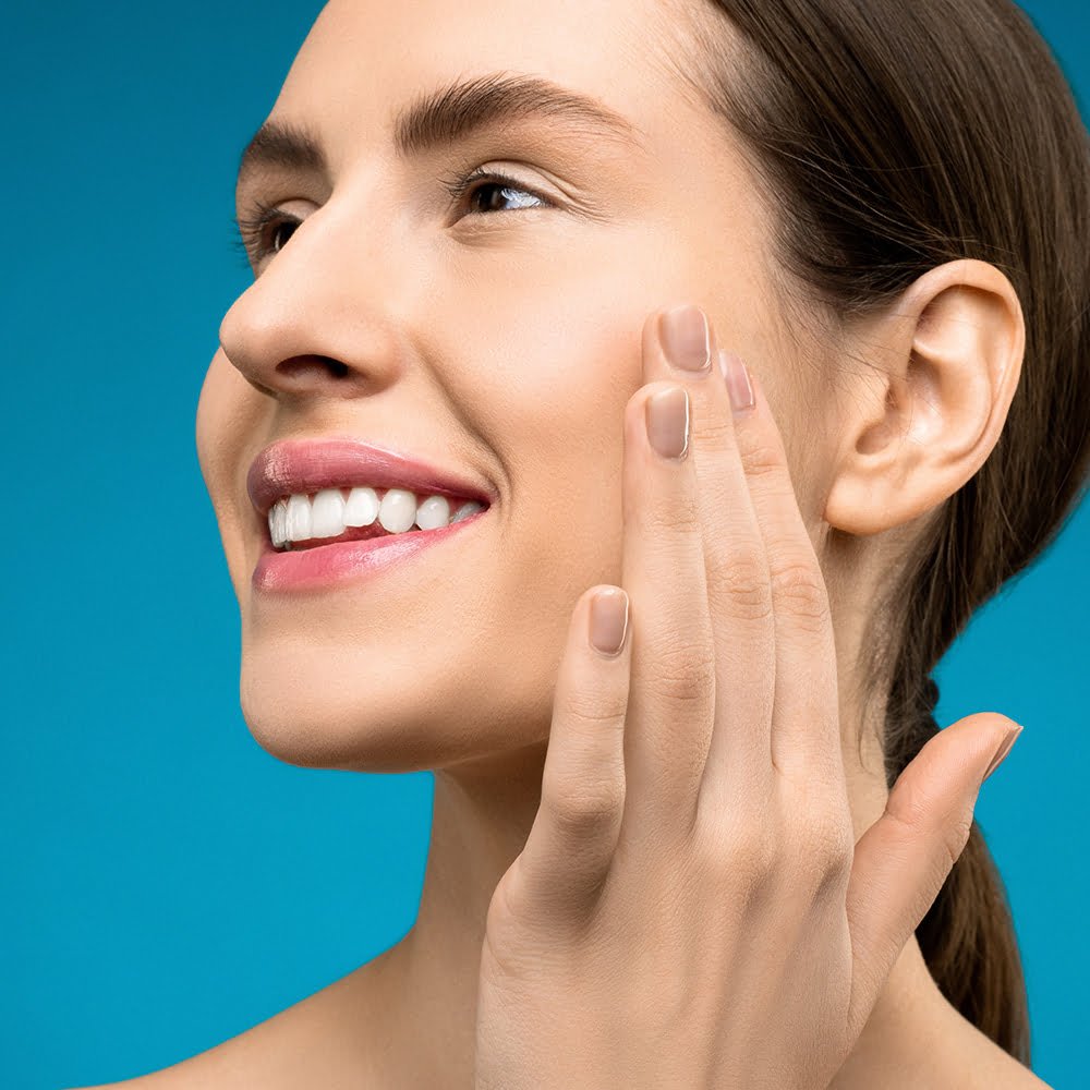 Smiling woman with pearly white teeth.