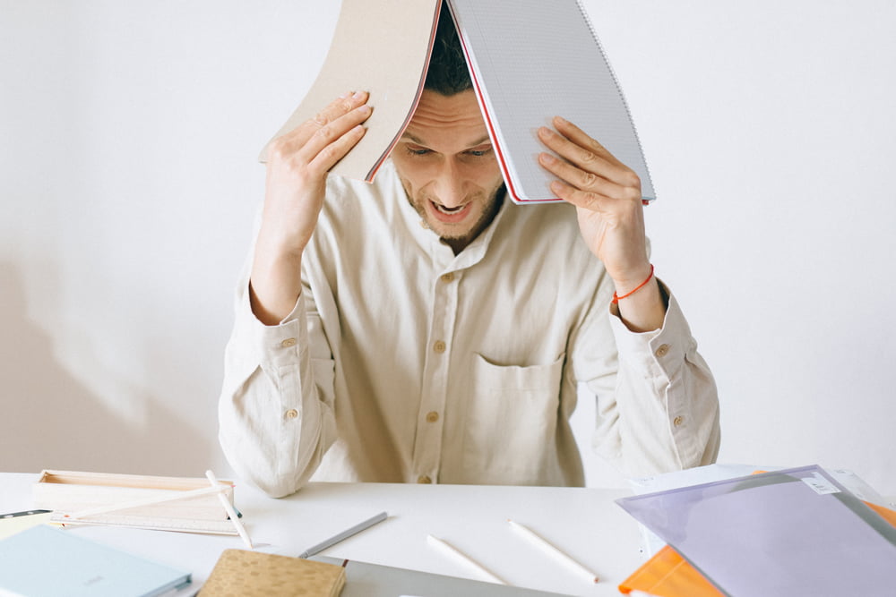 Employee appears to be experiencing a mental breakdown at desk